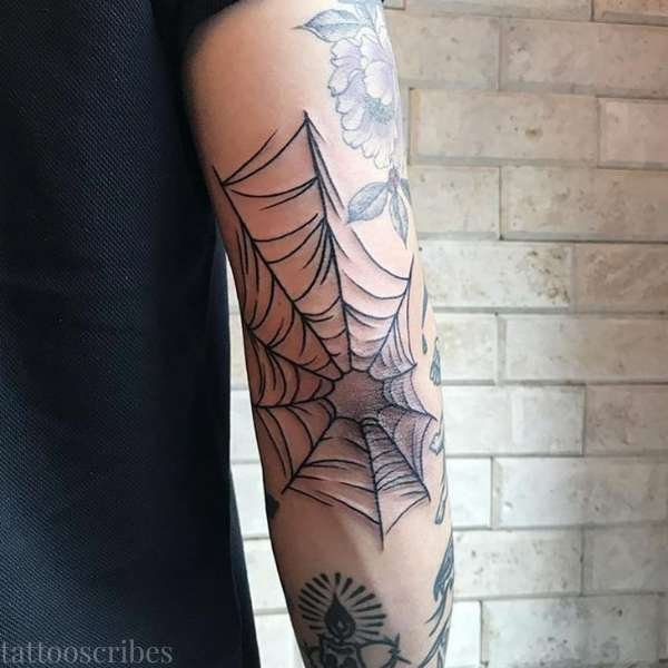 spider web elbow tattoo meaning