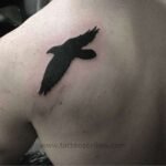 Discover 6 Inspiring Black Bird Tattoo Meanings Today