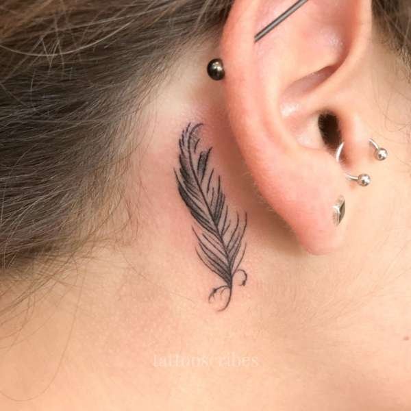 feather tattoo behind the ear meaning