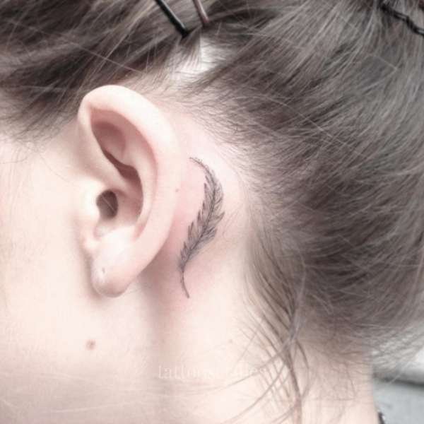 feather tattoo behind the ear meaning