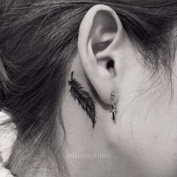 feather tattoo behind the ear meaning