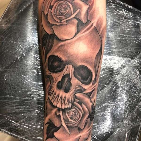 rose with skull tattoo meaning