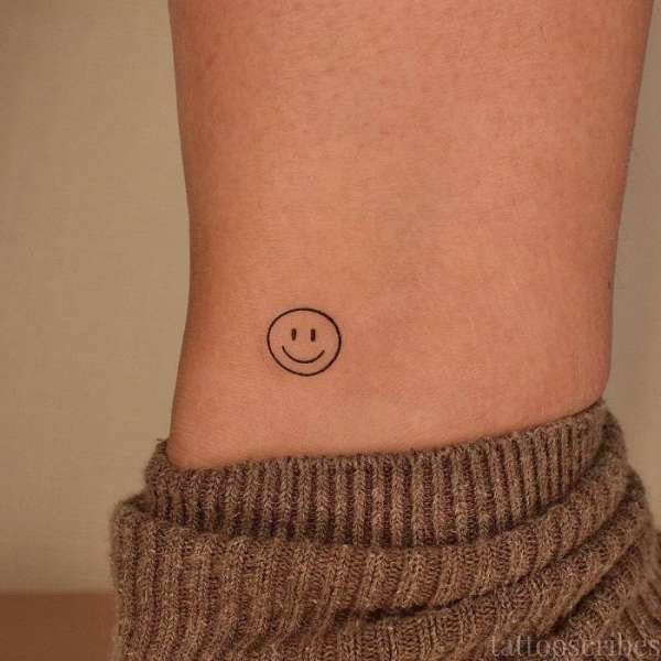 smiley face tattoo meaning